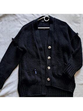 oversized black knit cardigan distressed with blue accents papermoon